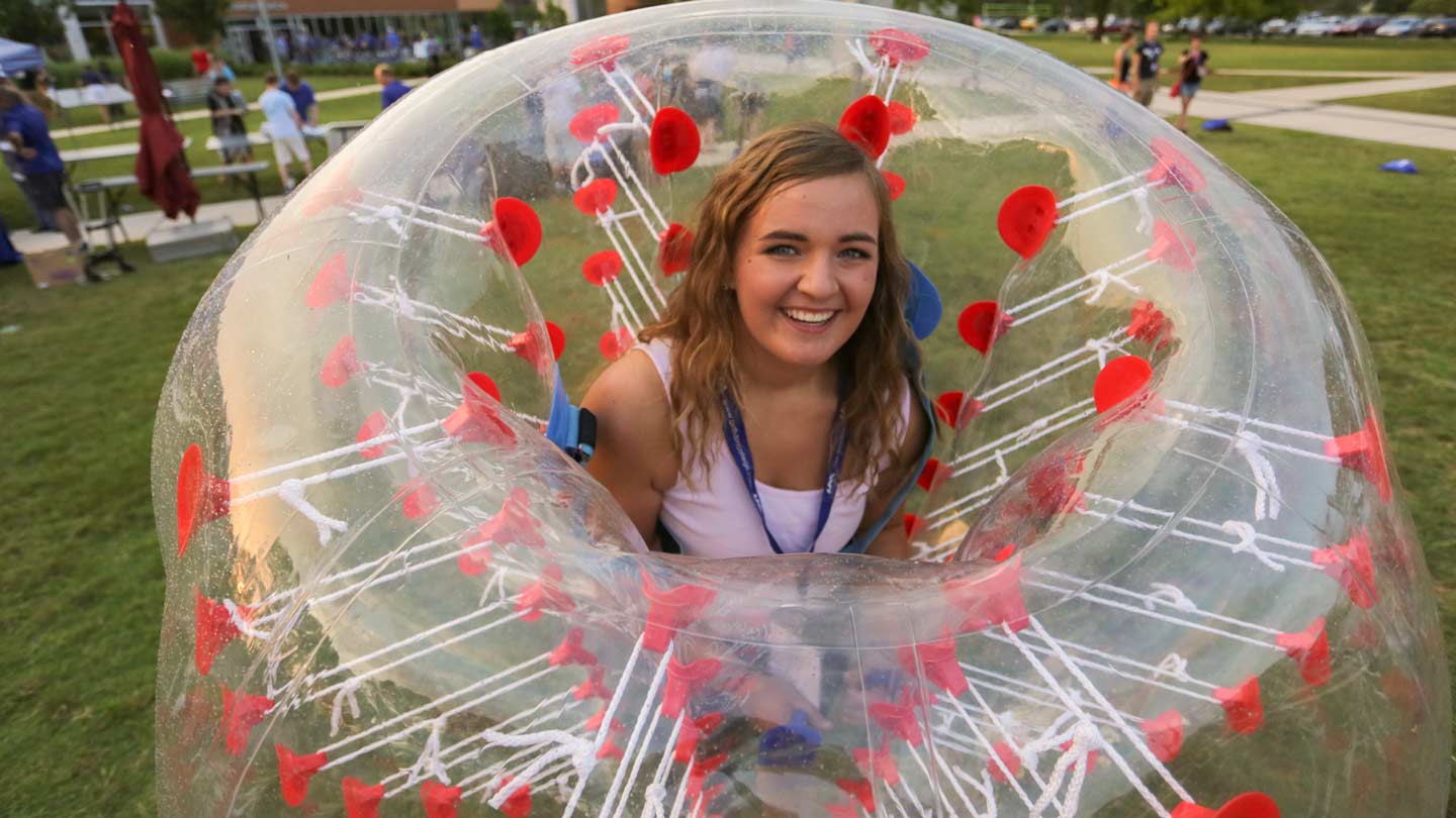 Girl inside large bounce ball